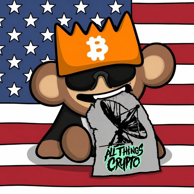 A cartoon illustration of a brown bear wearing an orange crown with a Bitcoin logo and black sunglasses, holding a sack labeled 'ALL THINGS CRYPTO' with a satellite dish graphic, set against an American flag background.