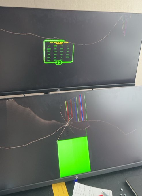 Two damaged computer monitors displaying cracks and colorful display glitches, with the top one showing an HP device manager BIOS interface.