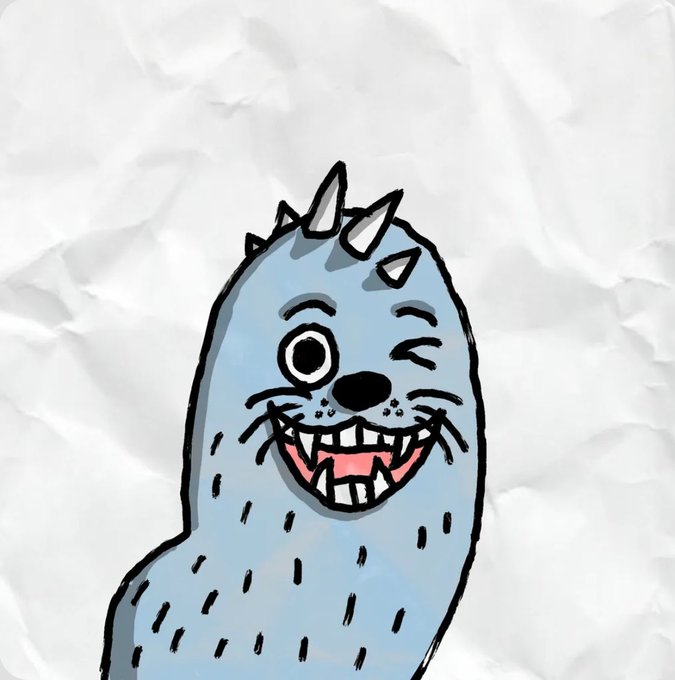 A cartoon-style drawing of a light blue, smiling monster or creature with horns, one large eye, and spiky fur, set against a crumpled white paper background.