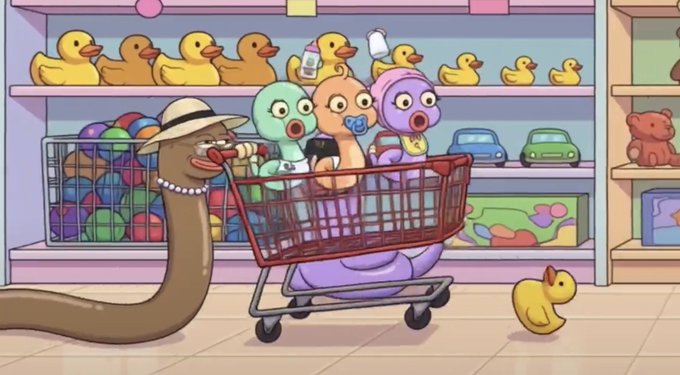 An animated cartoon scene showing a snake pushing a shopping cart containing three baby figures, with rubber ducks and toys on shelves in the background.