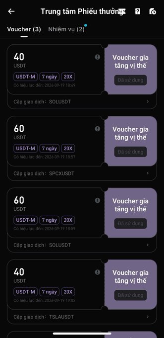 A mobile app screenshot titled 'Trung tâm Phiếu thưởng' (Voucher Center) showing a list of position-based vouchers in USDT, including 'SOLUSDT', 'SPCXUSDT', and 'TSLAUSDT', with a 7-day validity and 20X leverage.