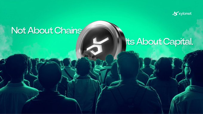 A marketing banner for xylonet featuring the slogan 'Not About Chains, It's About Capital' with a crowd illustration and metallic logo.