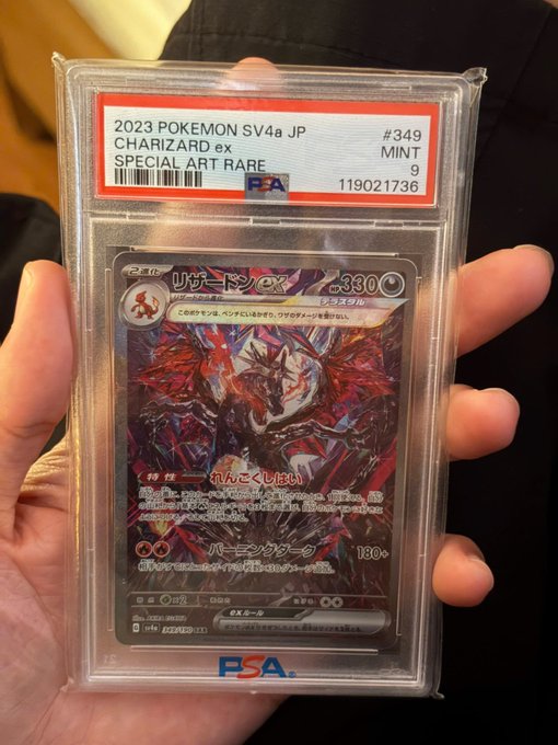A hand holds a PSA-graded Mint 9 Japanese 2023 Pokémon SV4a Charizard ex Special Art Rare #349 card in a protective slab.