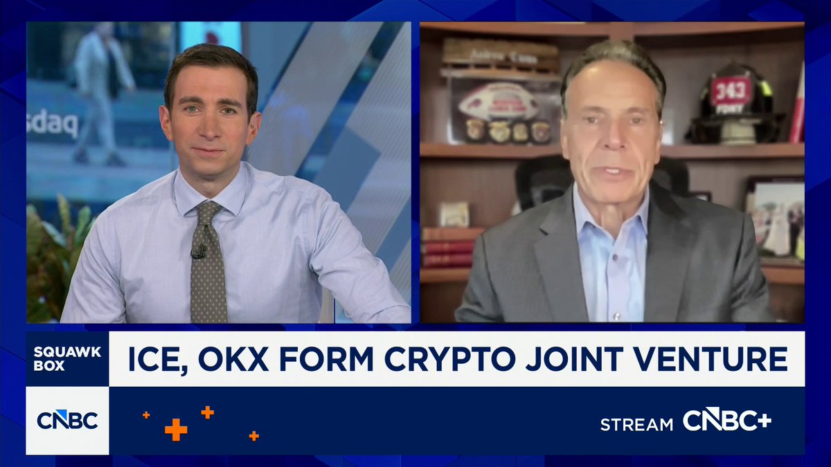 The image is a CNBC "Squawk Box" segment featuring former NY Governor Andrew Cuomo (right) being interviewed about the ICE and OKX crypto joint venture, as indicated by the chyron text "ICE, OKX FORM CRYPTO JOINT VENTURE" — a discussion that aligns with his recent comments urging Congress to pass crypto regulation like the CLARITY bill before the U.S. falls behind globally.