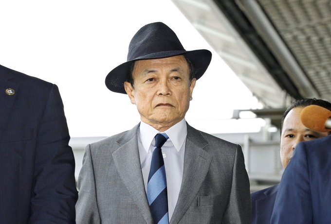 An older man wearing a fedora and grey suit stands looking somber, reflecting the negative sentiment of the accompanying post regarding a Bitcoin ($BTC) weekend pump.