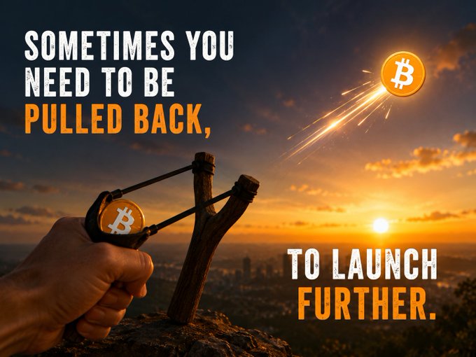 A hand pulls back a slingshot loaded with a Bitcoin coin, ready to launch it like a fiery projectile across a sunset skyline, with text reading "SOMETIMES YOU NEED TO BE PULLED BACK, TO LAUNCH FURTHER." The image visually reinforces the post's message by depicting a market pullback as the necessary tension before Bitcoin's next major rally.