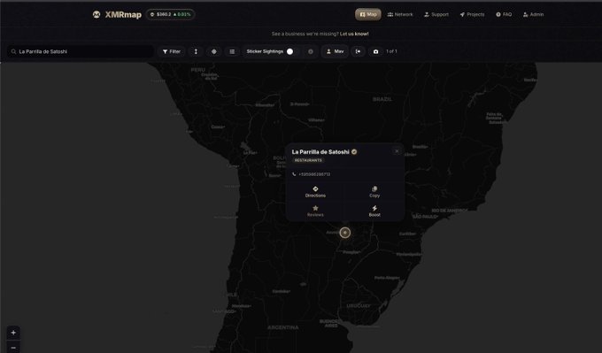 A dark-themed screenshot of the XMRmap website shows a map of South America with a popup for 'La Parrilla de Satoshi' featuring options to Directions, Copy, Reviews, and Boost.