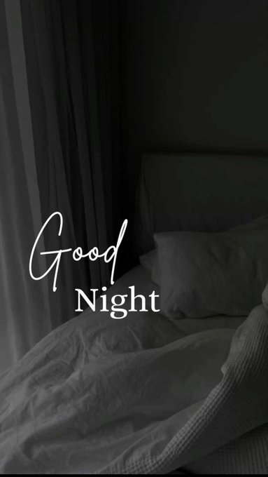 A dark, monochromatic photo of a bed with rumpled sheets and pillows, overlaid with the text 'Good Night' in white cursive and print fonts.