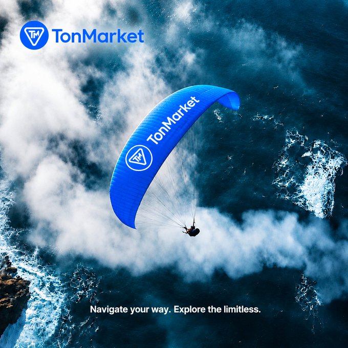 A paraglider with a blue TonMarket-branded parachute soars over a dramatic ocean landscape, accompanied by the tagline 'Navigate your way. Explore the limitless.'