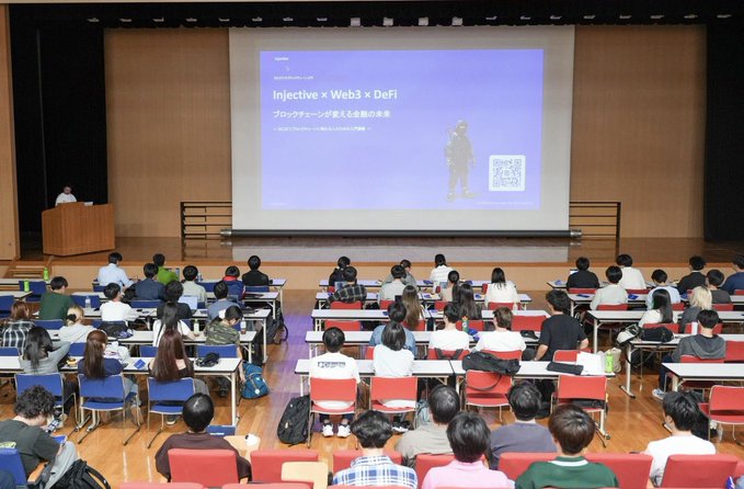 ichi-go-no-9af0, a Japanese film festival, is being held on a stage with a large screen displaying the title and description of the event.