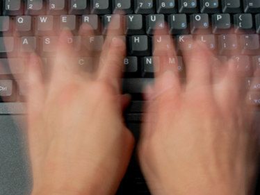A pair of hands rapidly types on a black keyboard, captured with motion blur to convey speed. The image complements the "Gm my fam!" greeting, illustrating the act of typing out a morning message.