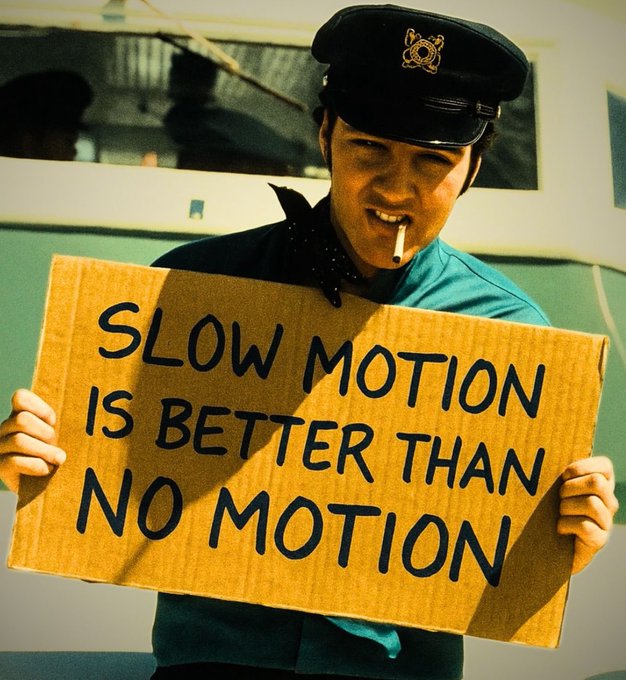 An image of a person dressed in a bus driver's uniform, holding a protest sign, smoking, and staring intensely at the camera appears in a social media post. The accompanying text says "gm mutual, it's Wednesday..... what are we clicking today?" Perhaps the post is promoting public transportation daily? The answer might not be clear without understanding what "gm mutual" is and what they're promoting or celebrating.