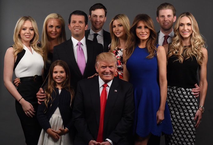 This image of Donald Trump and his family is accompanied by claims of his significant crypto disclosures, including over $100M in holdings and $635M from meme coins like $TRUMP.