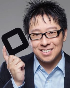 A man with glasses and a friendly smile holds up a black square with a white square cutout, resembling a stylized Bitcoin logo. The image accompanies Samson Mow's bold statement that Bitcoin under $100,000 represents a once-in-a-lifetime buying opportunity, with the Bitcoin-themed graphic visually reinforcing his bullish stance.