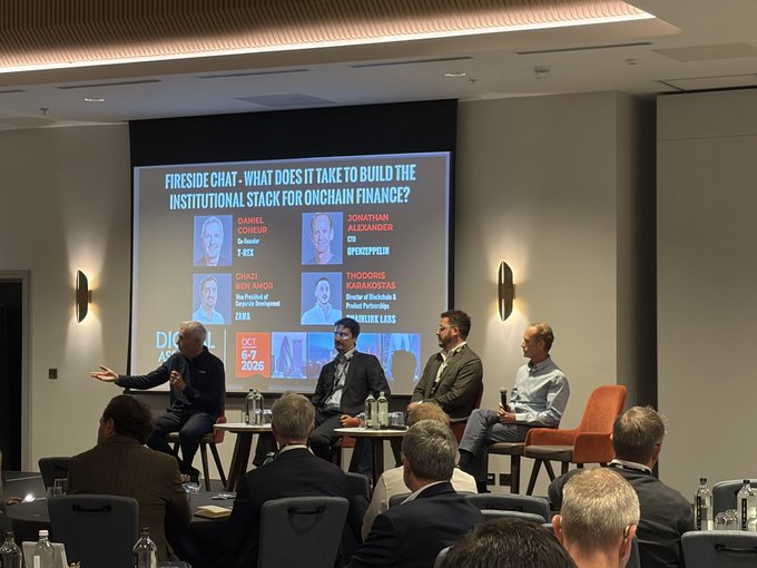 A panel discussion at a conference titled 'FIRESIDE CHAT: WHAT DOES IT TAKE TO BUILD THE INSTITUTIONAL STACK FOR ONCHAIN FINANCE?' featuring speakers from V.FX, Coinbase, ZURA, and Product Partnerships, dated October 5-7, 2026.
