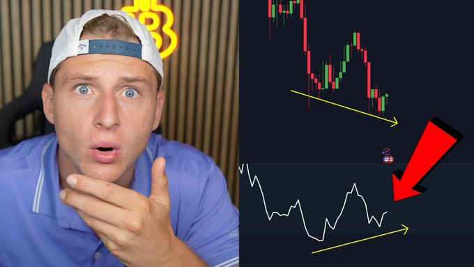 A shocked man in a blue polo and backwards cap gestures toward a split-screen showing a Bitcoin price chart with a downward-trending candlestick pattern and a line graph, both highlighted with yellow arrows and a large red arrow emphasizing a divergence—illustrating the "historic Bitcoin bear trap" referenced in the post.