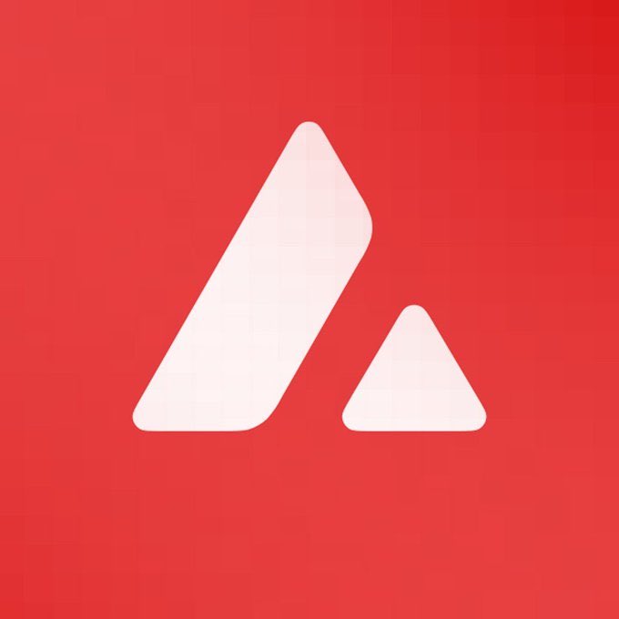 The image features a red background with an upward-pointing triangle, which is the logo for Avalanche. The text "AVAX" is written below the triangle, indicating that this is the name of the cryptocurrency being promoted. The caption provided after the image explains that Avalanche is not trying to replace Ethereum but rather aims to change the financial system by offering a new way to manage transactions and assets.