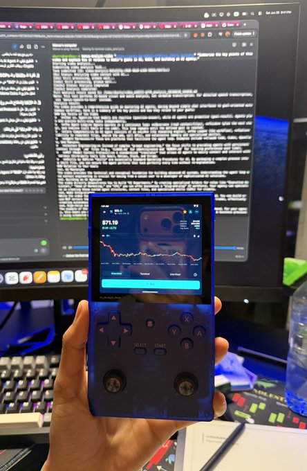 The image shows a person holding up a blue Nintendo Wii game controller, which appears to be an old model. The person's hand is positioned over a computer monitor displaying some text or data. The background of the image features a keyboard and mouse on a desk, suggesting that this scene takes place in a workspace or office environment.

The post seems to be discussing whether they should buy more Nintendo Wii games, as indicated by the phrase "SOL $71 Should we buy more?". This could imply that the person holding up the controller is considering purchasing additional games for their console.