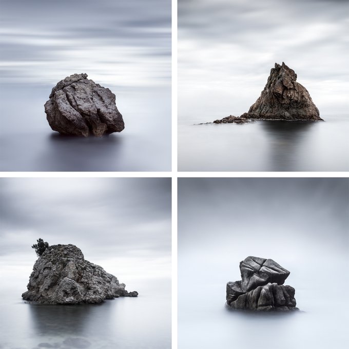 A four-panel grid of long-exposure black and white photographs showing different rock formations rising from calm water with smooth, misty skies.