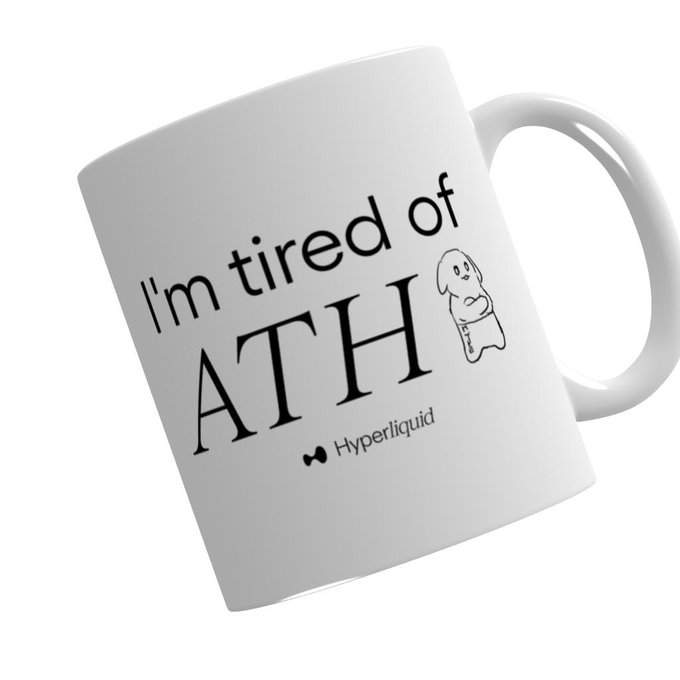 The image features a white coffee mug with black text that reads "I'm tired ofATH" written in an artistic font style, accompanied by a cartoon dog character. The mug has a handle on one side for easy holding. The background of the image is plain white, which makes the text and design stand out prominently.