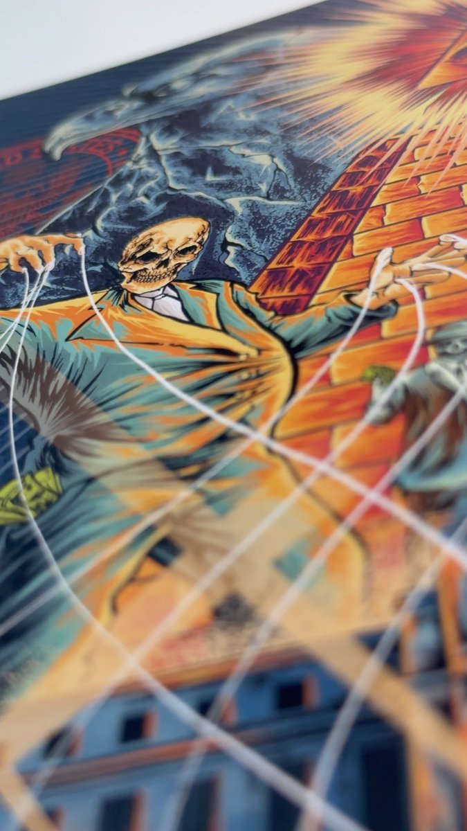 A comic-book style illustration depicts a masked character with a skull face being shot by multiple laser beams in an urban alleyway setting.