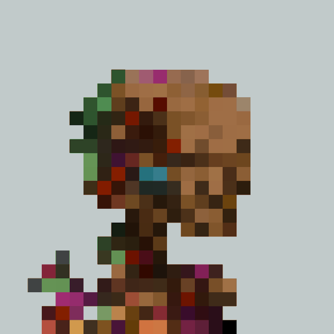 A heavily pixelated image showing blocky brown, green, and pink colors on a light background.