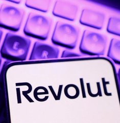 A close-up image shows the "Revolut" logo displayed on a smartphone screen, positioned over a purple-lit keyboard. The image contrasts centralized digital banking with the post's message advocating for Bitcoin self-custody and taking financial control away from third-party institutions like Revolut.