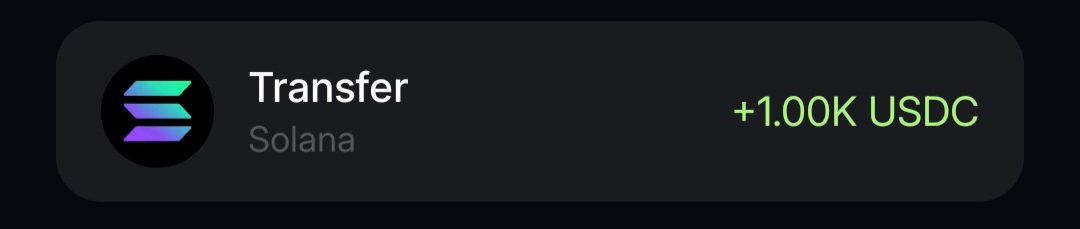 A digital wallet interface displays a 'Transfer' on the 'Solana' network, showing a received amount of '+1.00K USDC' in green text.