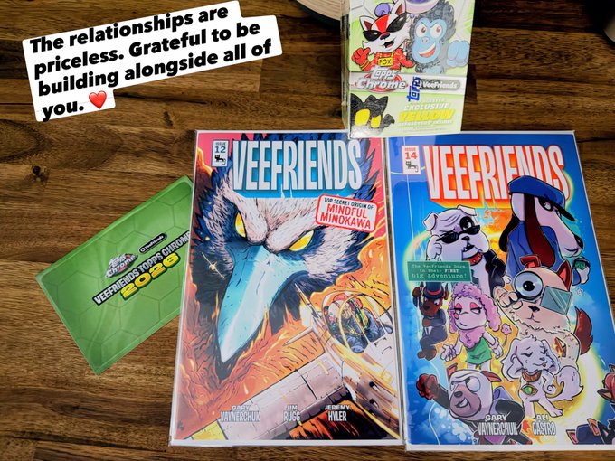 Two 'VEEFRIENDS' comic books by Gary Vaynerchuk, issue 12 'MINDFUL MINOKAWA' and issue 14, displayed on a wooden table with character cards and a note reading 'The relationships are priceless. Grateful to be building alongside all of you.'