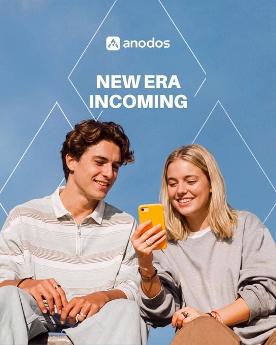 A promotional image for "anodos" featuring a young couple looking at a yellow smartphone together, with the text "NEW ERA INCOMING" displayed prominently.