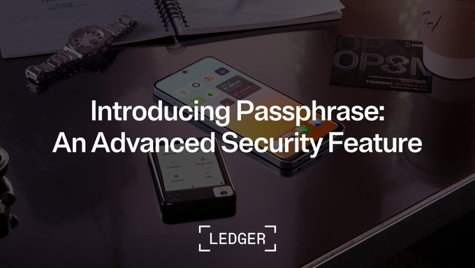 The image is a promotional graphic for Ledger's "Passphrase" security feature, featuring two smartphones displaying app interfaces on a desk alongside a wristwatch, notebook, and a "Leather Open" card. The bold white text reads "Introducing Passphrase: An Advanced Security Feature" with the Ledger logo below. The visual directly supports the post's message about the lesser-known 25th word option by showcasing Ledger's mobile app where users can manage this advanced security feature.