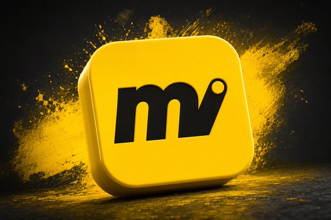 The image features a yellow square app icon with black text that reads "m" followed by an "i", which could be interpreted as "motion" or "motion tracking". The app icon is placed against a black background, making it stand out prominently. The surrounding area appears to have been splattered with paint, adding a creative and artistic touch to the image.