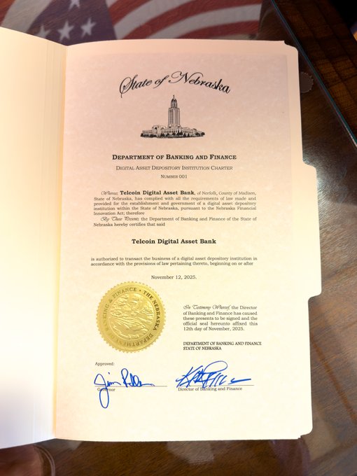 A 'State of Nebraska' Department of Banking and Finance Digital Asset Depository Institution Charter document for Telcoin Digital Asset Bank, dated November 12, 2025, featuring an official gold seal and an American flag in the background.