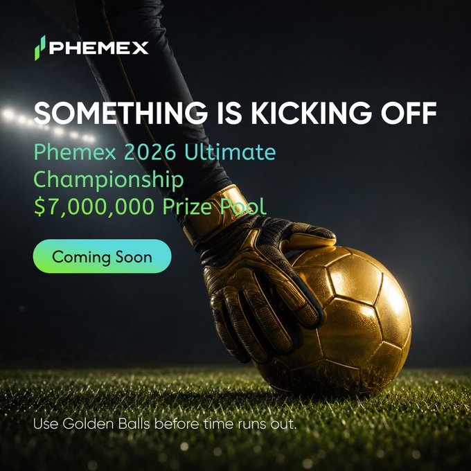 The image features a gold soccer ball lying on green grass with white text around the edges reading "Something is kicking off Phemex 2026 Ultimate Championship $7M USDT total pool. One global cup season. One event page. Watch the matches, join the action, and win rewards". The background of the photo includes a night sky and a soccer field in the foreground.