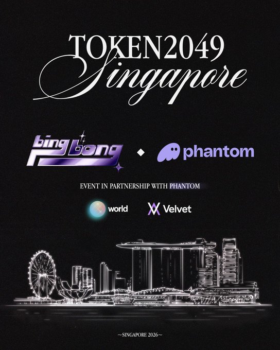 A sleek promotional poster for Token2049 Singapore 2026 features the "Big Bang" logo in partnership with Phantom, alongside World and Velvet, set against a dark background with an illuminated Singapore skyline silhouette. The design ties directly to the event announcement, highlighting Big Bang's return to Singapore for one of their largest gatherings yet, now backed by prominent crypto partners.