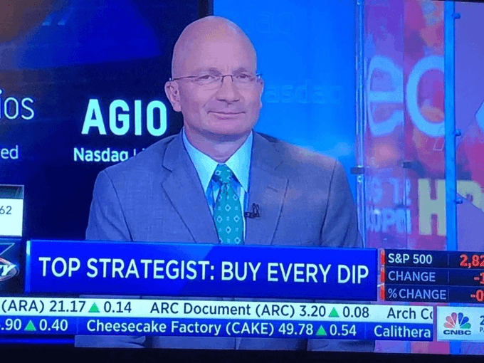 A CNBC television segment features a top strategist in a gray suit and teal tie being interviewed on screen, with the headline "TOP STRATEGIST: BUY EVERY DIP" displayed prominently. The accompanying post references the Jackson Hole event and suggests any resulting dip would be worth bidding on, aligning with the bullish "buy every dip" message shown on screen.