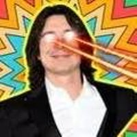 A digitally edited image of a man with long dark hair smiling, with red laser beams shooting from his eyes against a colorful, swirling background.