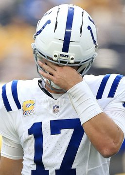 An Indianapolis Colts NFL player wearing jersey number 17 and a white helmet, placing his hand on his face.