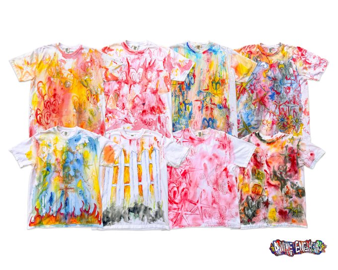A collection of eight t-shirts is displayed flat against a white background, each featuring colorful, abstract hand-painted designs in various vibrant hues, with 'Anything Engaged' text in the corner.