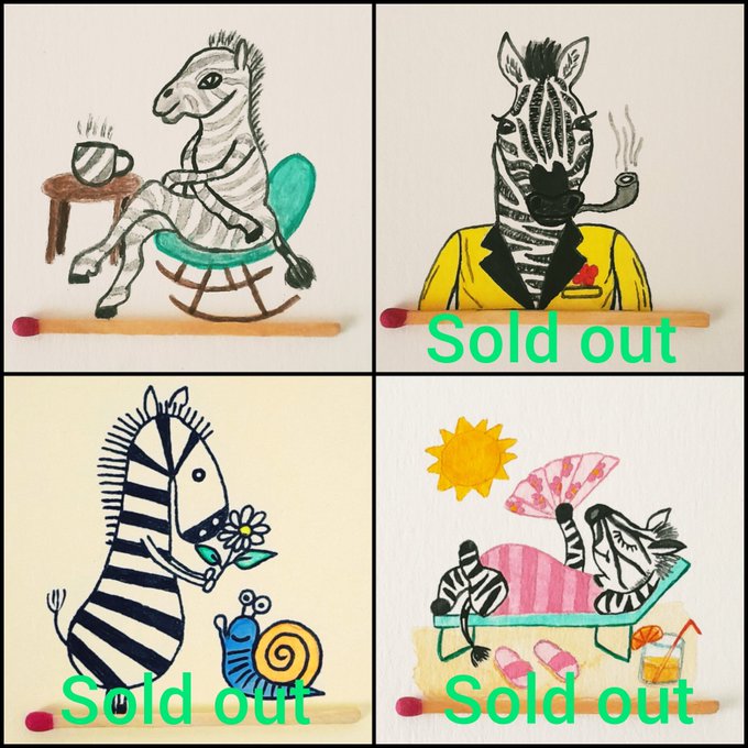 Four cartoon zebra illustrations displayed on wooden sticks, showing zebras in a rocking chair with coffee, smoking a pipe in a yellow suit, holding a flower next to a snail, and lounging with a fan. Three panels have 'Sold out' text overlay.