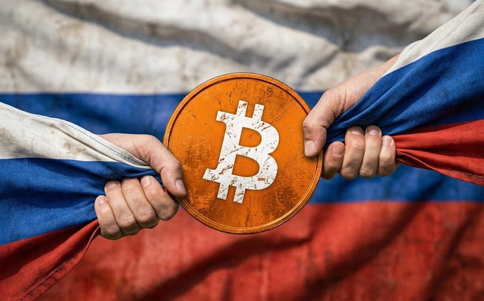 Two hands grip the Russian flag as they pull it apart to reveal a large orange Bitcoin coin in the center, symbolizing Russia's move to integrate cryptocurrency into its financial system.

The image visually represents the post's news about Russia registering top banks like Sberbank and VTB for Bitcoin services, with the Bitcoin coin emerging from within the Russian flag's tricolor to illustrate the nation's growing embrace of crypto custody and exchange services.