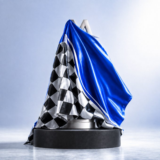 A checkered racing flag and blue cover drape over a sleek metallic trophy atop a black pedestal, evoking the anticipation of a grand reveal—mirroring the post's tease of a hidden giveaway dropping soon, with $USDT prizes for 25 winners.
