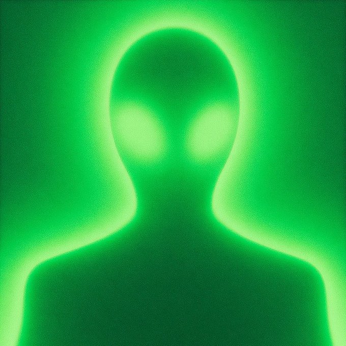 A simple, stylized illustration of a silhouetted alien figure with glowing green eyes against a solid green background.