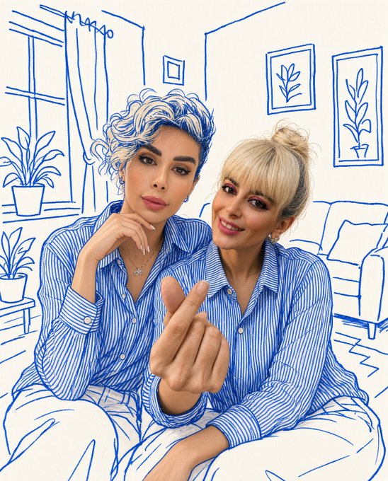 Two women sit together against a white background with blue line-drawn illustrations of a living room, one of them extending her hand toward the camera in a finger heart gesture.