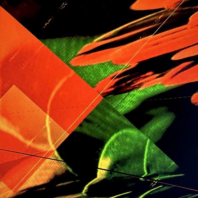 An abstract, glitch-style image with overlapping triangular shapes in red, green, and black, featuring streaky light artifacts and crossed hairline-thin lines.