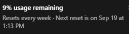 A dark image with heavily distorted, unreadable white text on a black background.