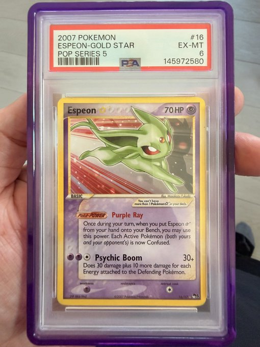 A hand holds a PSA-graded 2007 Pokemon 'Espeon-Gold Star' card from the POP Series 5, number 16, with a grade of 6.