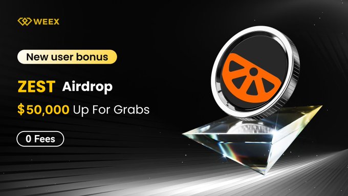 The image shows a diamond-shaped object with an orange border, which appears to be a coin or a token from the ZEST airdrop project. The text displayed on the screen reads "New user bonus ZEST Airdrop" and "50,000 USDT! Enjoy 0-fee trading and Unlock multiple rewards!" It also mentions that there is a post about "ZEST airdrop: $ZEST - 50,000 - Airdrop: 
Uptime: [06/05/2021 - 17:00:40] 
Author: @WEEX_Official RT #Airdrop #blockchain #tradetoearn #bitcoinprice #ethereumprice"