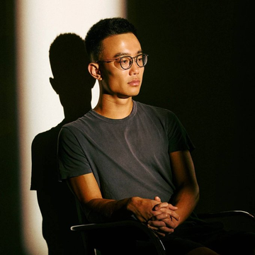 A portrait of a man wearing glasses and a gray t-shirt, seated with hands clasped, illuminated by dramatic side lighting that casts a sharp shadow behind him.

The image complements the post by visually representing Jeff Yan, the Hyperliquid CEO quoted in the caption, capturing him in a thoughtful pose that aligns with the message about pioneering innovation rather than imitation.