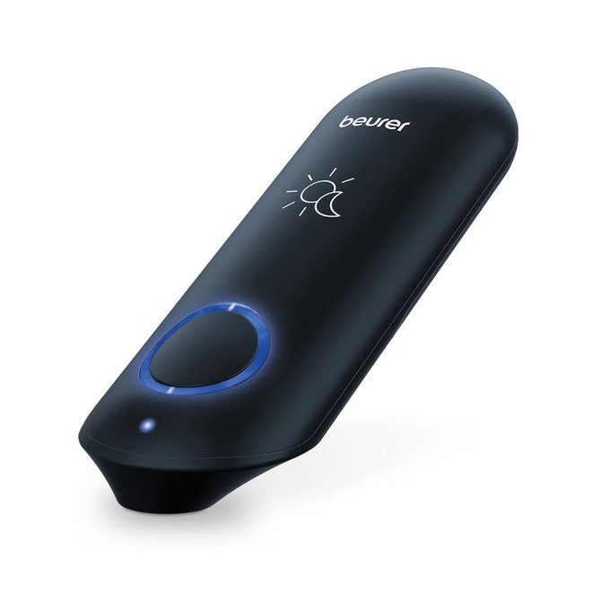 A product image of a black handheld Beurer device featuring a sun/moon icon and a circular blue illuminated button on a white background.